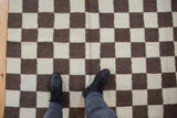 Ivory and chocolate brown geometric checkered pattern of the hand woven Indian Kilim.