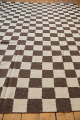 Close-up of hand woven Indian Kilim featuring chocolate brown and ivory checkered squares.