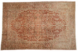 Vintage distressed Heriz carpet, geometric medallion, deep red and ivory field, silver tones.