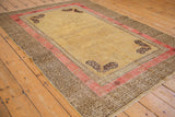 Antique Khotan rug corner with unusual charcoal butterfly and T-motif border.