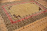 Antique Khotan rug corner featuring unusual charcoal butterfly and running T border.