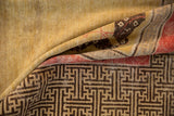 Antique Khotan rug's inner border with brown reciprocating T motif and pale raspberry stripe.