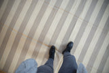 Hand woven Egyptian Kilim carpet with ivory and oxidized silver horizontal stripes.