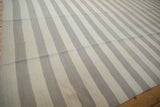 Horizontal ivory and oxidized silver striped Egyptian Kilim with minor abrashes.