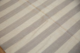 Detail of hand woven Egyptian Kilim with horizontal ivory and oxidized silver stripes.