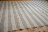 Hand woven Egyptian Kilim's intact side cord selvage with ivory and oxidized silver stripes.