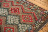 Intricate geometric gul motifs and serrated palmettes on the vintage Afghani Kilim.