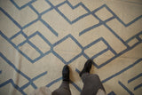 Ivory and pale denim blue abstract geometric pattern on a contemporary Afghani Kilim.