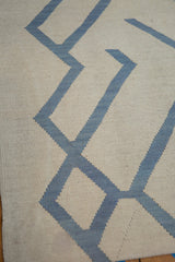 Hand-woven Afghani Kilim with contemporary pale denim blue abstract geometric lines on ivory.