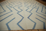 Abstract contemporary kilim pattern featuring pale denim blue and ivory weave.