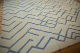 Close-up of hand woven Afghani Kilim's contemporary abstract ivory and pale denim blue pattern.