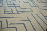 Abstract mountain motif in pale denim blue on an ivory Afghani kilim.