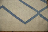 Textured ivory and pale denim blue abstract geometric weave of an Afghani Kilim rug.