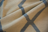 Textured hand-woven Afghani kilim, showing ivory and pale denim blue abstract geometric weave.