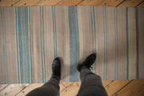 Flatweave Afghani Kilim runner with vertical pale blue, beige, and dusty green stripes.