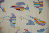 Embellished raised stitching creates colorful pictorial birds on a flat ivory kilim weave.