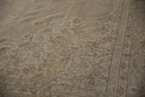 Distressed vintage Sparta carpet detail: ivory and silver tone-on-tone floral vines.