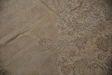 Distressed vintage Sparta carpet pile with even wear, showing faint scrolling vine patterns.