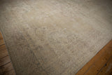 Vintage Distressed Sparta carpet corner, scrolling vine border featuring faded ivory and beige tones.