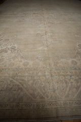 Distressed Sparta carpet's sprawling vinery and bud main border with muted ivory and platinum tones.