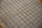 Textured distressed pile of the vintage Oushak runner, revealing beige and pale mauve checkered squares.