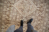 Vintage distressed Mahal carpet pile with visible knot heads and muted Herati pattern.