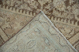 Distressed Mahal carpet detail, showing worn brown pile, exposed foundation, and robust hand-knotted backing.
