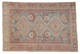 Distressed vintage Afshar rug, triple geometric medallions in muted sky blue, madder red, and coffee.