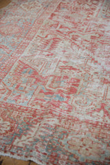 Distressed Karaja rug pile with mostly even wear, faded cherry red and pale blue patterns.