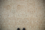 Distressed Persian Bijar carpet with delicate lattice vinery and abrash in soft beige and pale blue.