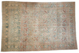 Distressed Khorassan carpet, faded powder blue and blush floral with distinct denim blue section.