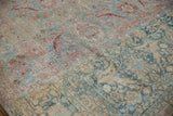 Detail of vintage distressed Khorassan rug, highlighting stark color shift and worn palmette motifs.