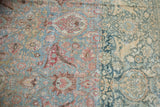 Distressed Khorassan carpet's prominent dye lot shift in worn powder blue and denim hues.