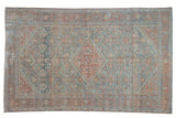 Vintage distressed Mahal rug with a central diamond medallion in powder blue, ruby red, and ivory tones.