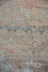Textural low pile of a distressed Mahal rug with powder blue and ruby red details.