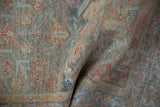Detail of the soft, low pile and hand-knotted texture of a distressed vintage Mahal rug.