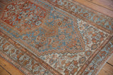 Distressed vintage Borchalou rug detail, showing worn sky blue and rust Herati patterns.