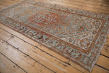 Distressed vintage Borchalou rug corner, showing sky blue and madder root rust Herati patterns.