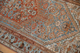 Distressed Borchalou rug close-up showing Herati pattern, madder root rust, and sky blue.