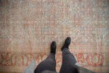Distressed vintage Mahal carpet with muted powder blue and terracotta Herati patterns.