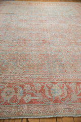Distressed vintage Mahal carpet texture with faded powder blue and terracotta Herati patterns.
