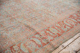 Distressed Mahal carpet: faded powder blue Herati field, terracotta serrated leaf border, wear visible.