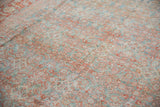 Distressed vintage Mahal rug texture with faded powder blue and terracotta Herati motifs.