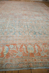 Distressed vintage Mahal rug border with faded terracotta, powder blue floral and leaf patterns.