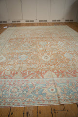Textural detail of vintage distressed Mahal rug, showing powder blue border and terracotta field with worn Herati vinery.