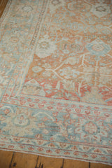 Mahal carpet corner; powder blue border, terracotta field, and mostly even wear.