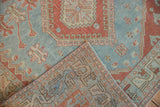 Distressed Caucasian rug showing powder blue, cherry red hand-knotted pile and foundation.