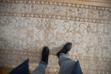 Distressed vintage Hamadan runner, showing faded platinum beige Herati and serbend boteh border.