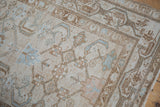 Distressed Hamadan runner close-up: geometric Herati motif, serbend border, beige, bronze, and powder blue.