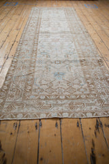Secured end fringe showcasing distressed texture and subtle geometric patterns of the Hamadan rug.